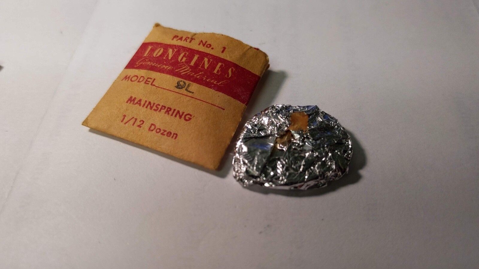 Longines 9L mainspring opened package