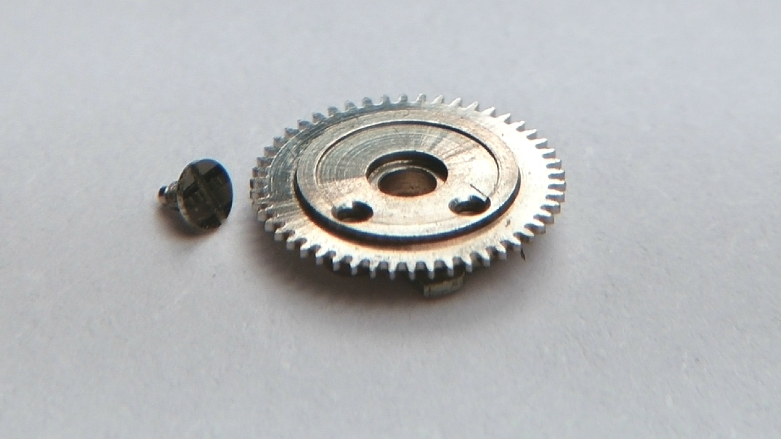 Le Coultre 911 2556-1 Date Indicator Driving Wheel mounted with Screw. NEW