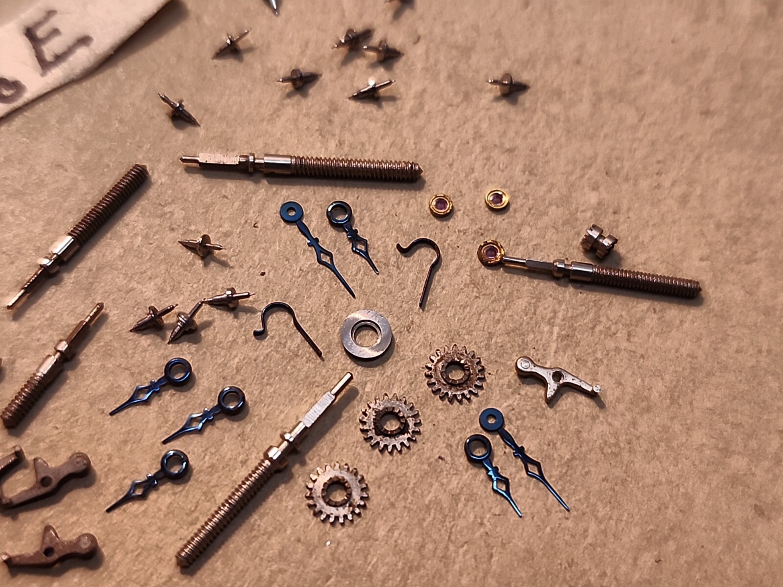 Lot Of NOS Elgin 21/0 Mixed Parts-Stems, Balance Staffs, Jewels, Hands, Etc