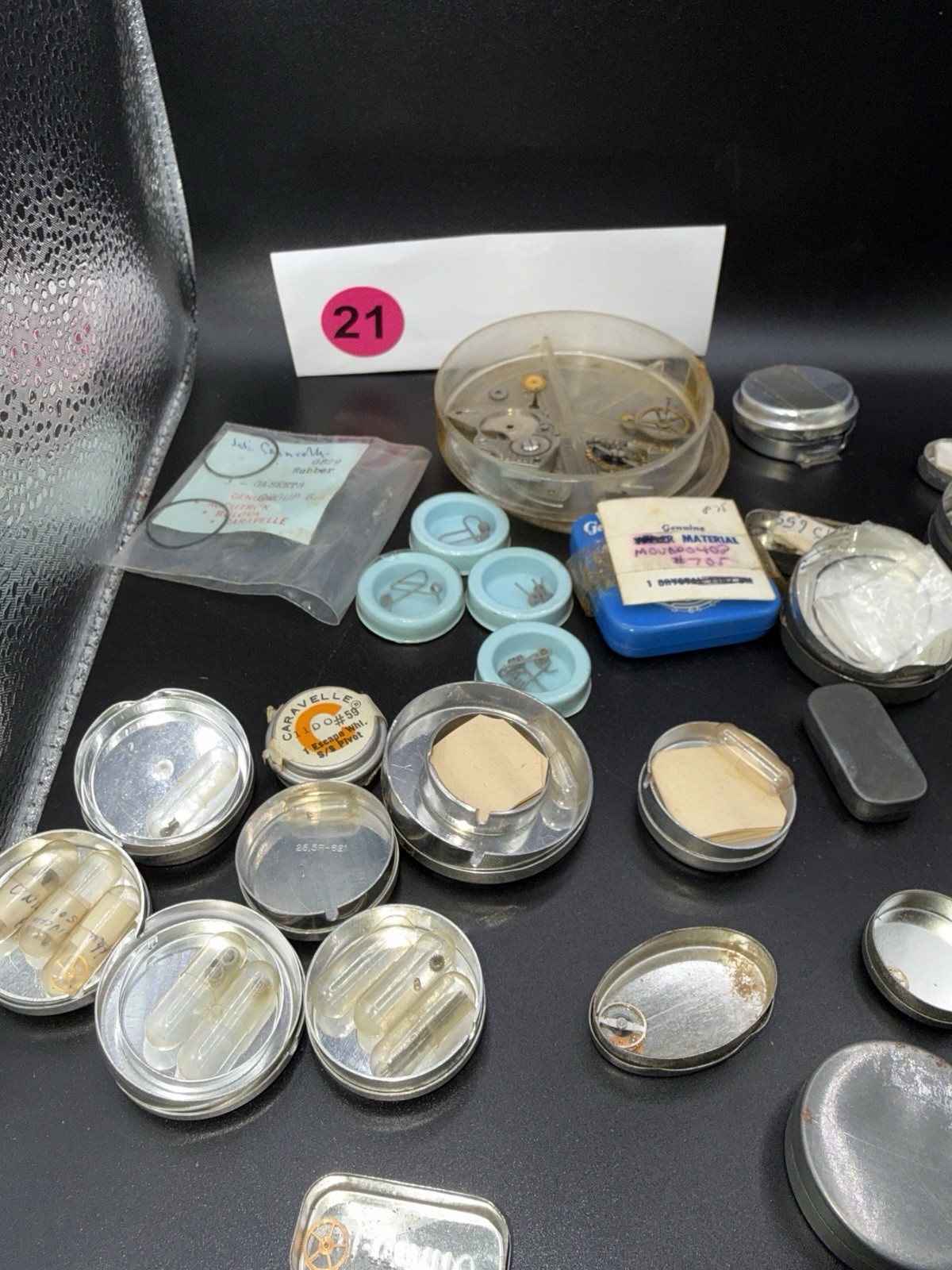 Lot 21 – Watchmaker Parts Lot Movements Staffs Tins Crystals Repair Mixed NOS