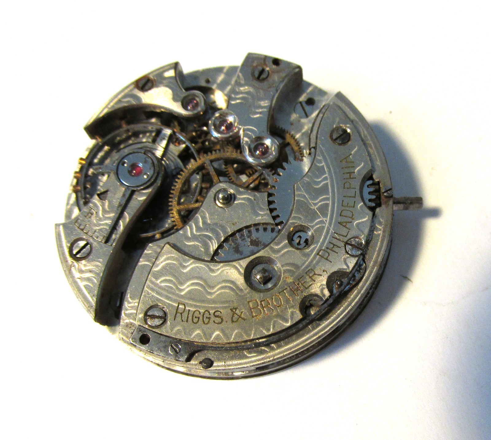 Pocket watch movement only, no case, dial or hands, private label – Riggs & Bro.