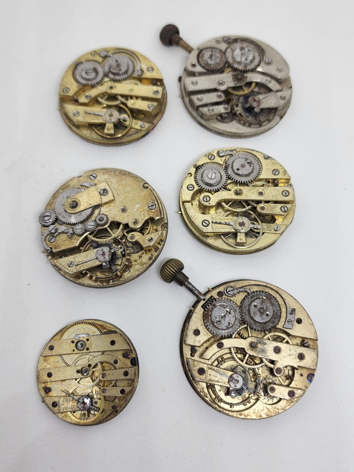 Lot of 6 high end pocket watch movements – Sold for parts – AS IS