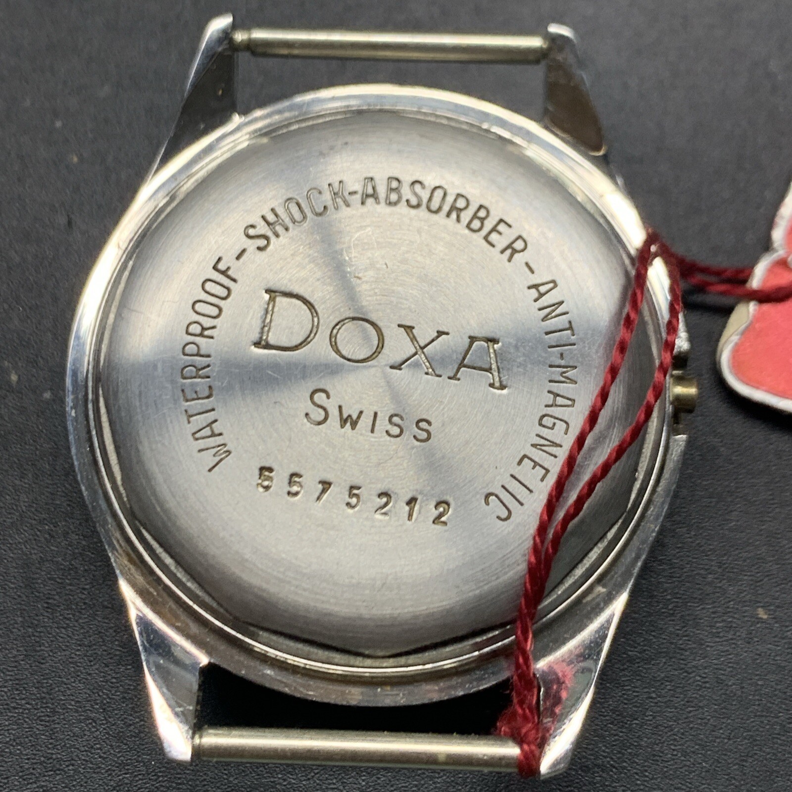 1950s SS NOS Doxa Screw Back Case With Original Tag 13930