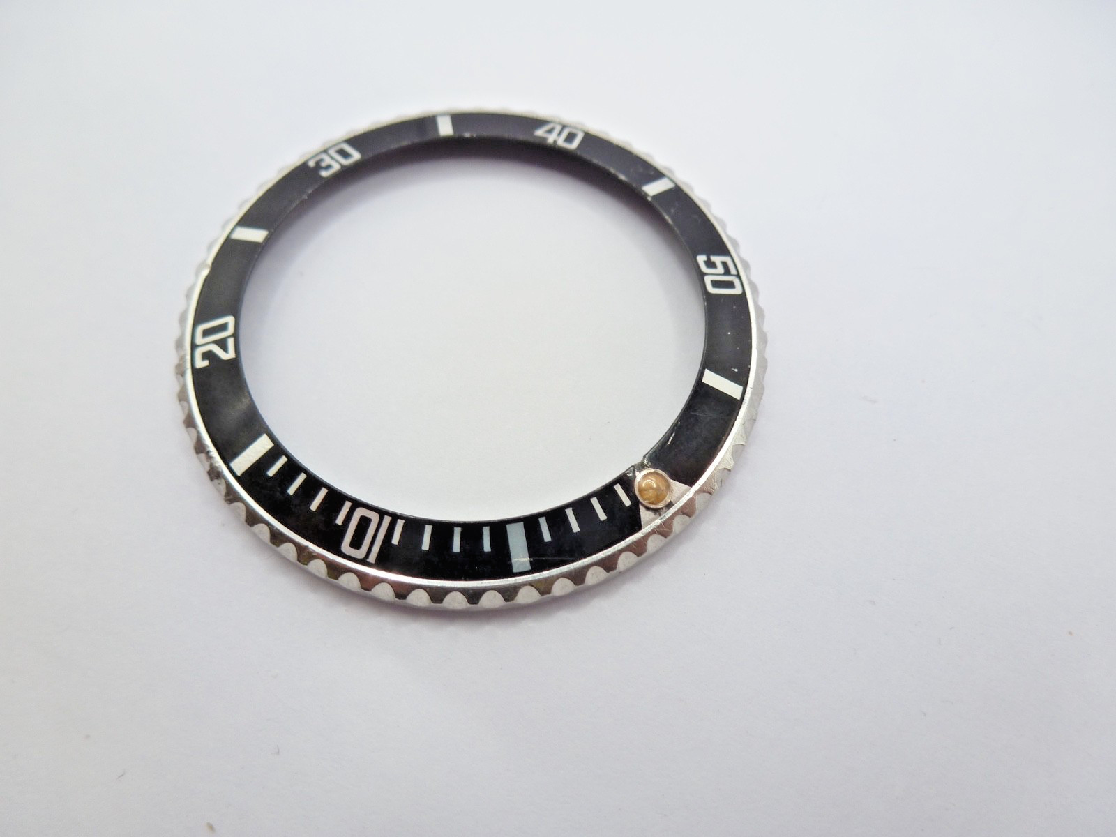 Genuine Rolex Submariner 16610/16800 complete bezel with insert vintage used .