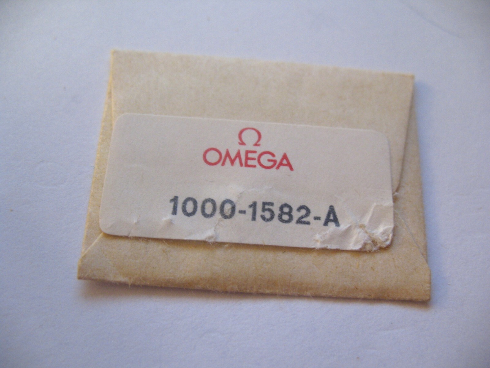 OMEGA 1000 DATE DISC BLACK NUMBERS ON SILVER 3 O’CLOCK PART 1582-A