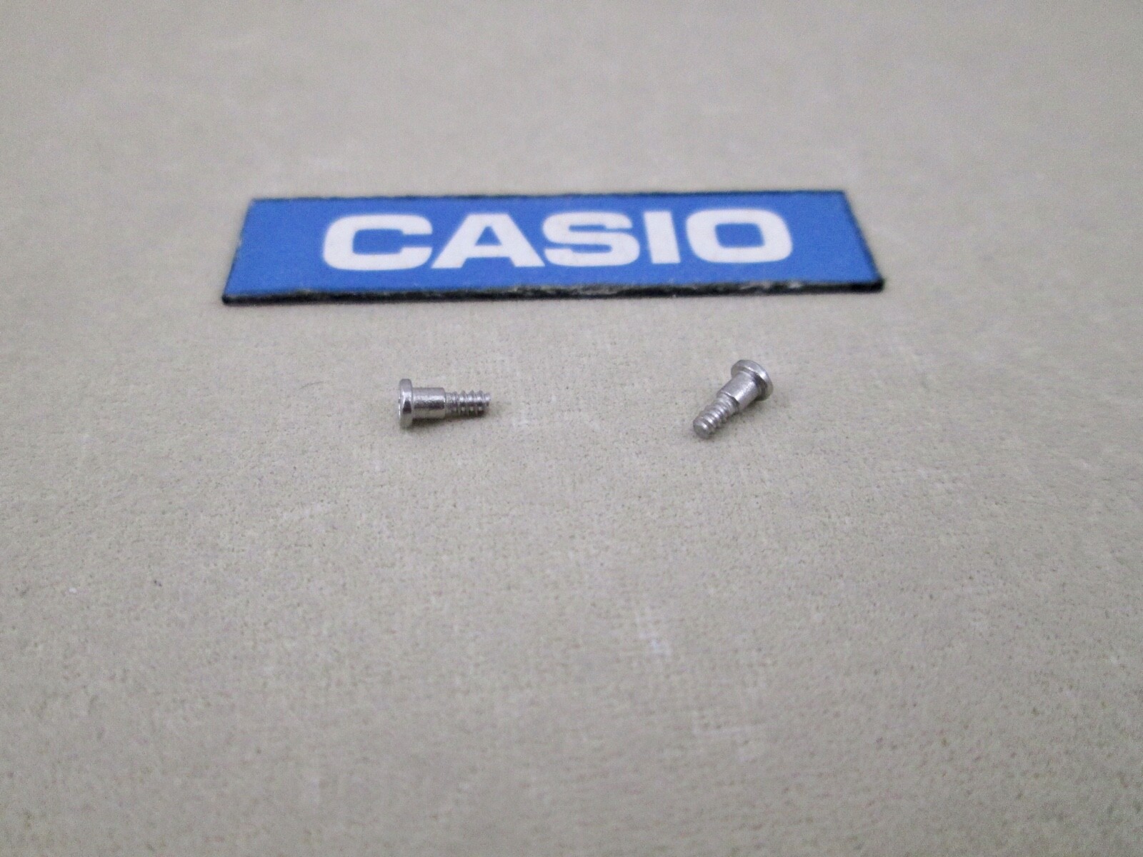Genuine Casio DW-5900 DW-6900 G-2300 PAG-40 PRG-40 BG-169 bezel screws X 2