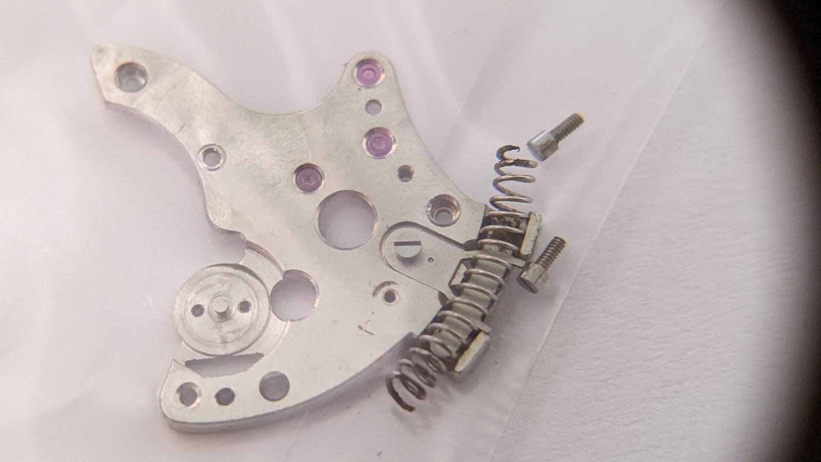 Genuine Lecoultre P812 balance bridge and 2 screws, spring. see photos. pre-owne