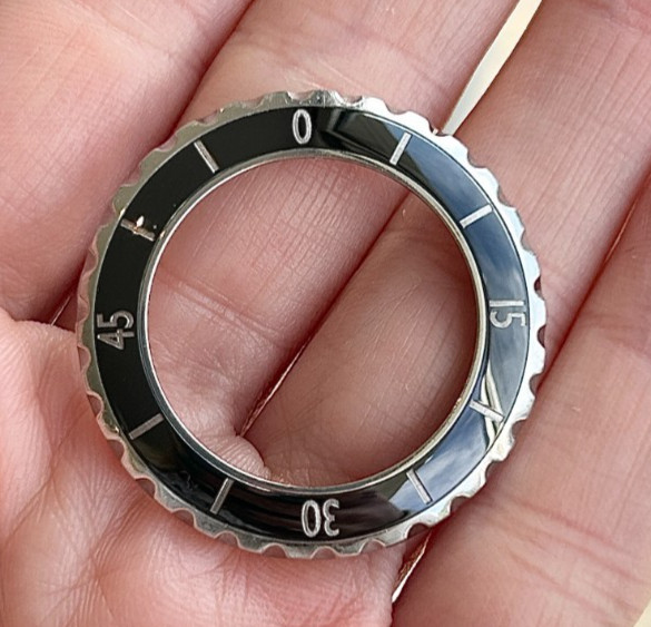 A Chanel J12 Black Ceramic Wristwatch Bezel for midsize model.