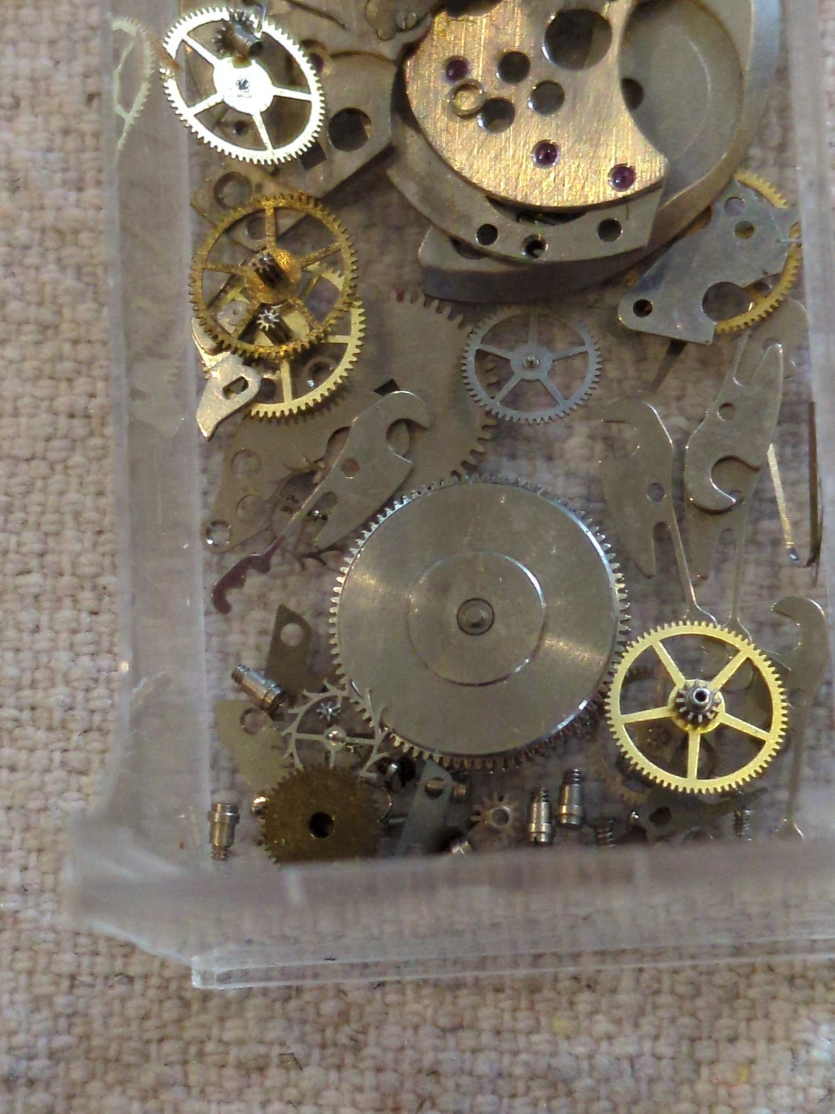 !Lot of 2 watch movements with a Box, Wheels, Plates, Screws, Springs, and more!