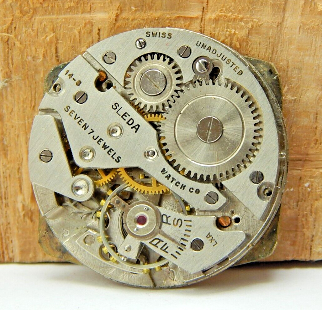Vintage Helzberg Sleda 14-8 7 jewel men’s wrist watch movement with case back