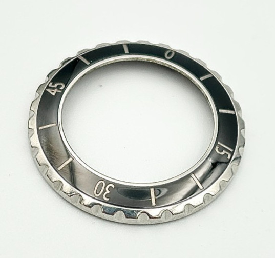 A Chanel J12 Black Ceramic Wristwatch Bezel for midsize model.