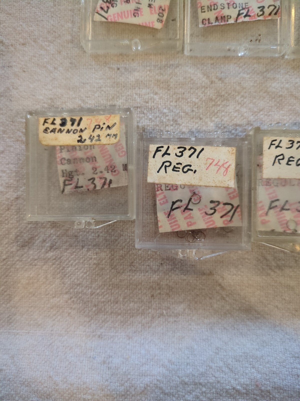 17 Boxes of Elgin 748 Movement Unused Jewels, Screws, Wheels, Regulators Etc…!