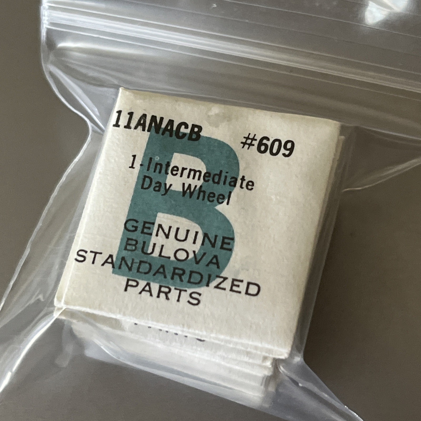 Bulova Watch 11ANACB Movement Part #609 (1) Intermediate Day Wheel Sealed Packet