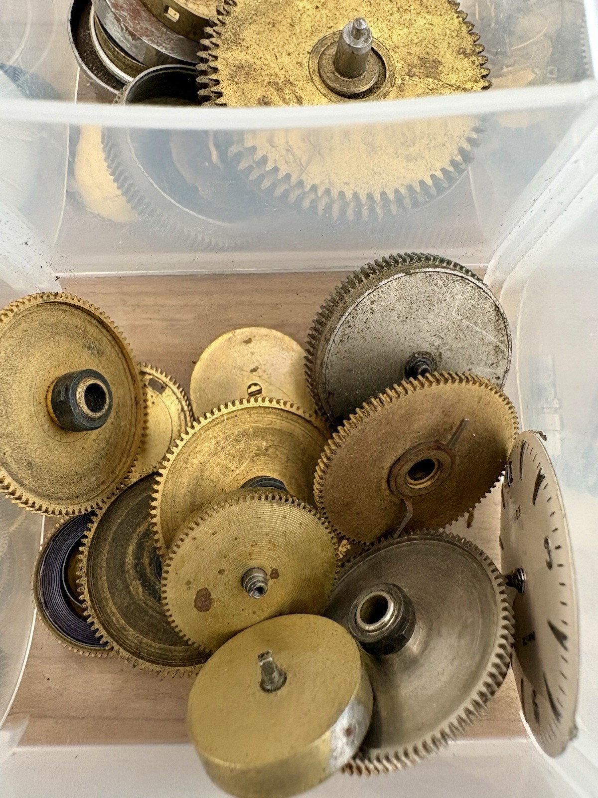 Watchmaker parts Lot w/ Box Movements Dials Gears Bulova Omega Benrus Elgin