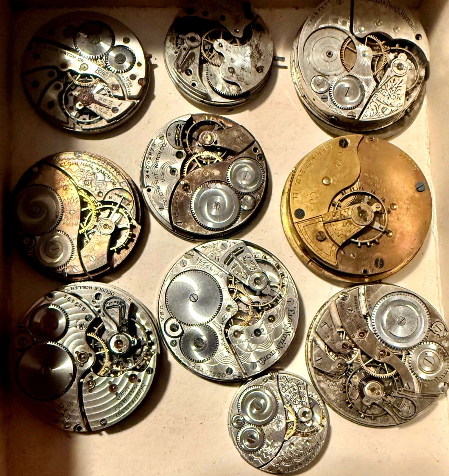 ANTIQUE LOT 10 DIFFERENT NAMES & SIZES POCKET WATCH MOVEMENT SELLING AS IS PARTS
