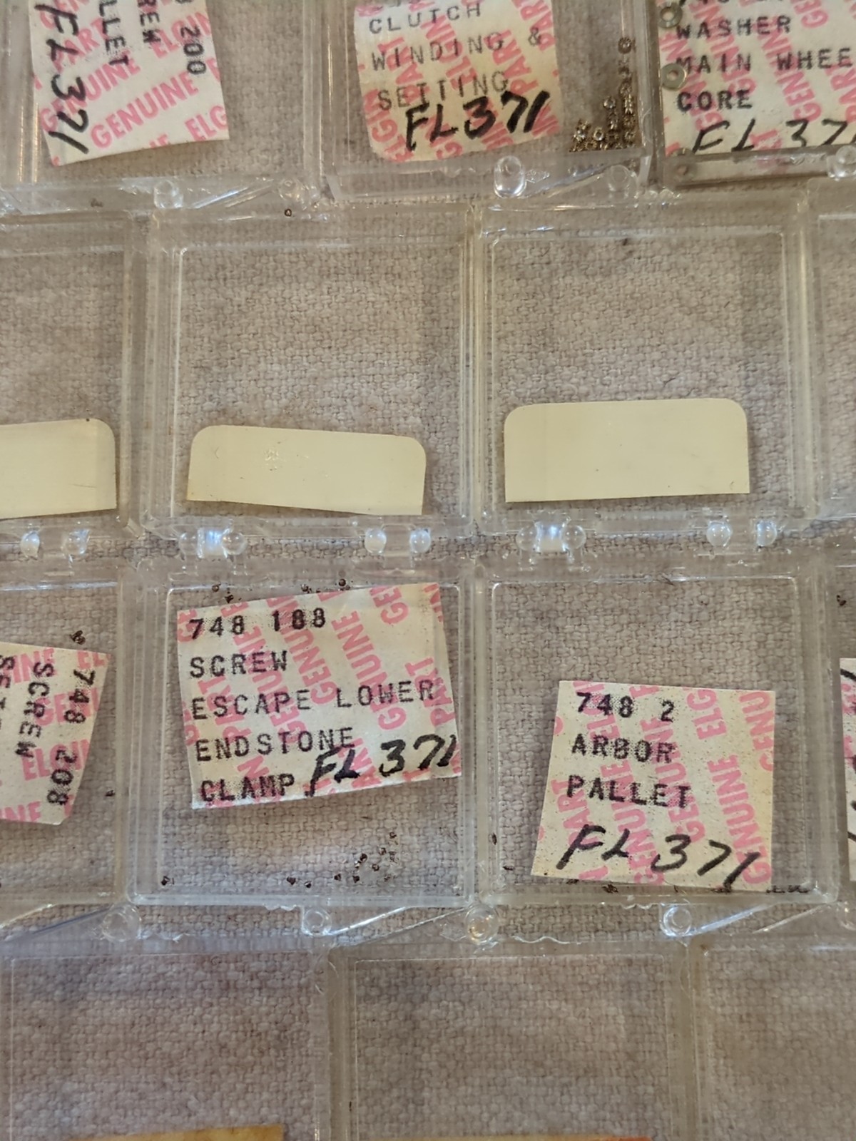 17 Boxes of Elgin 748 Movement Unused Jewels, Screws, Wheels, Regulators Etc…!
