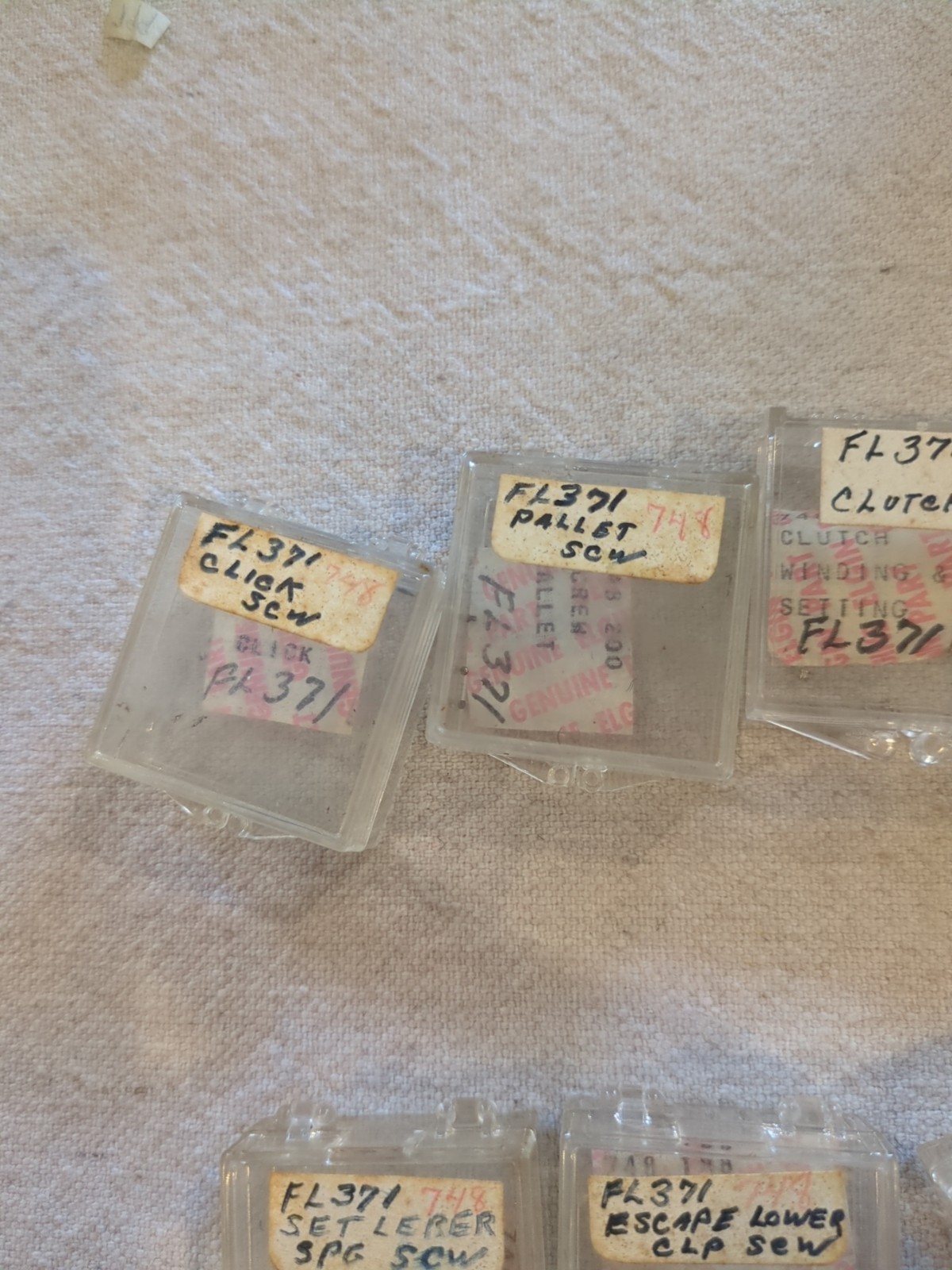17 Boxes of Elgin 748 Movement Unused Jewels, Screws, Wheels, Regulators Etc…!