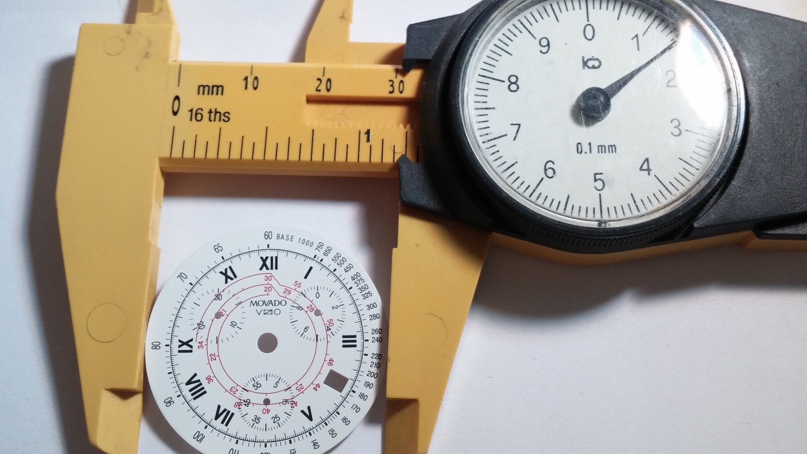 Movado Vizio dial, white, red, black, date window, chrono, 31.6mm diameter