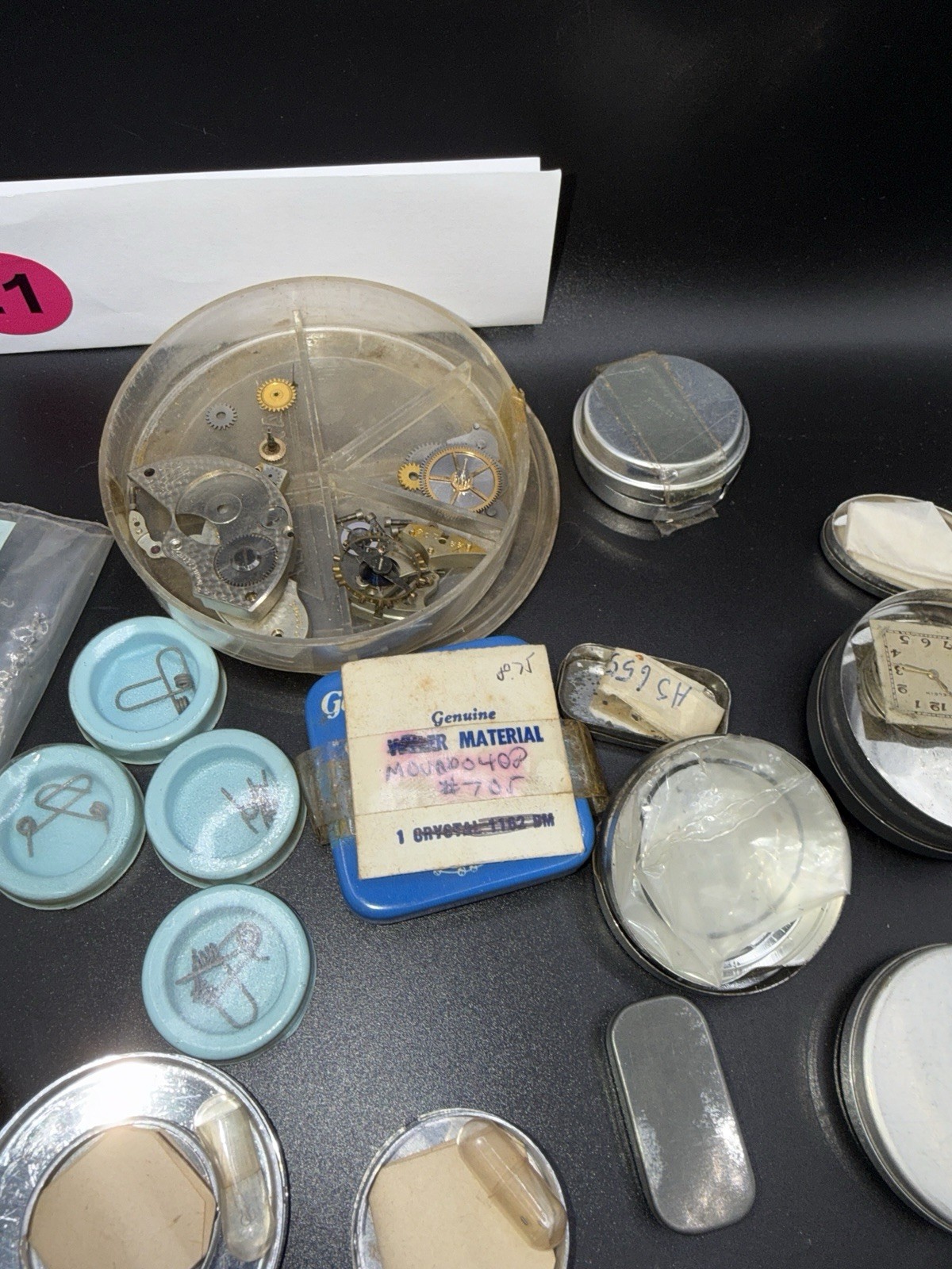 Lot 21 – Watchmaker Parts Lot Movements Staffs Tins Crystals Repair Mixed NOS