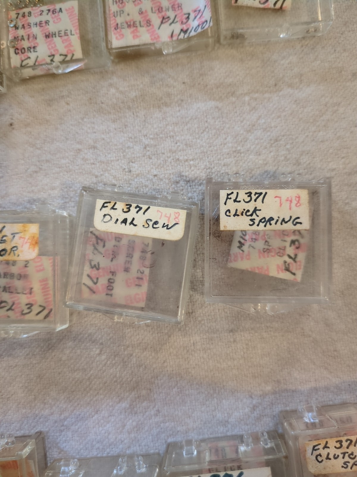 17 Boxes of Elgin 748 Movement Unused Jewels, Screws, Wheels, Regulators Etc…!
