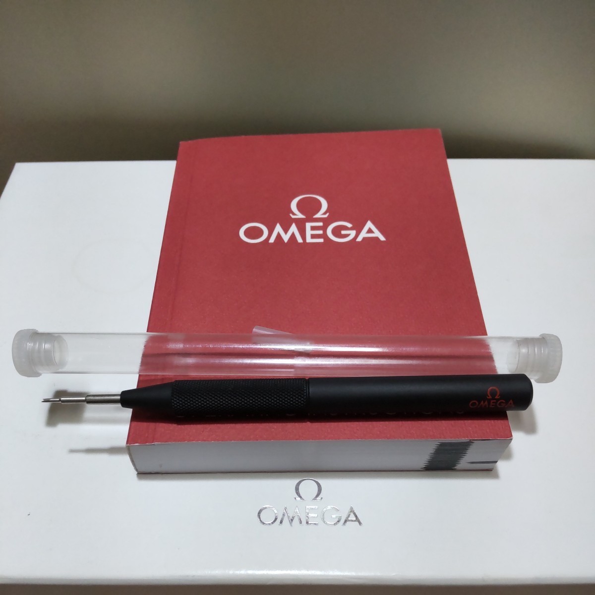 Omega OMEGA Logo, Genuine Black BK Pin, Red Lettering, Spring Bar Removal Tool,
