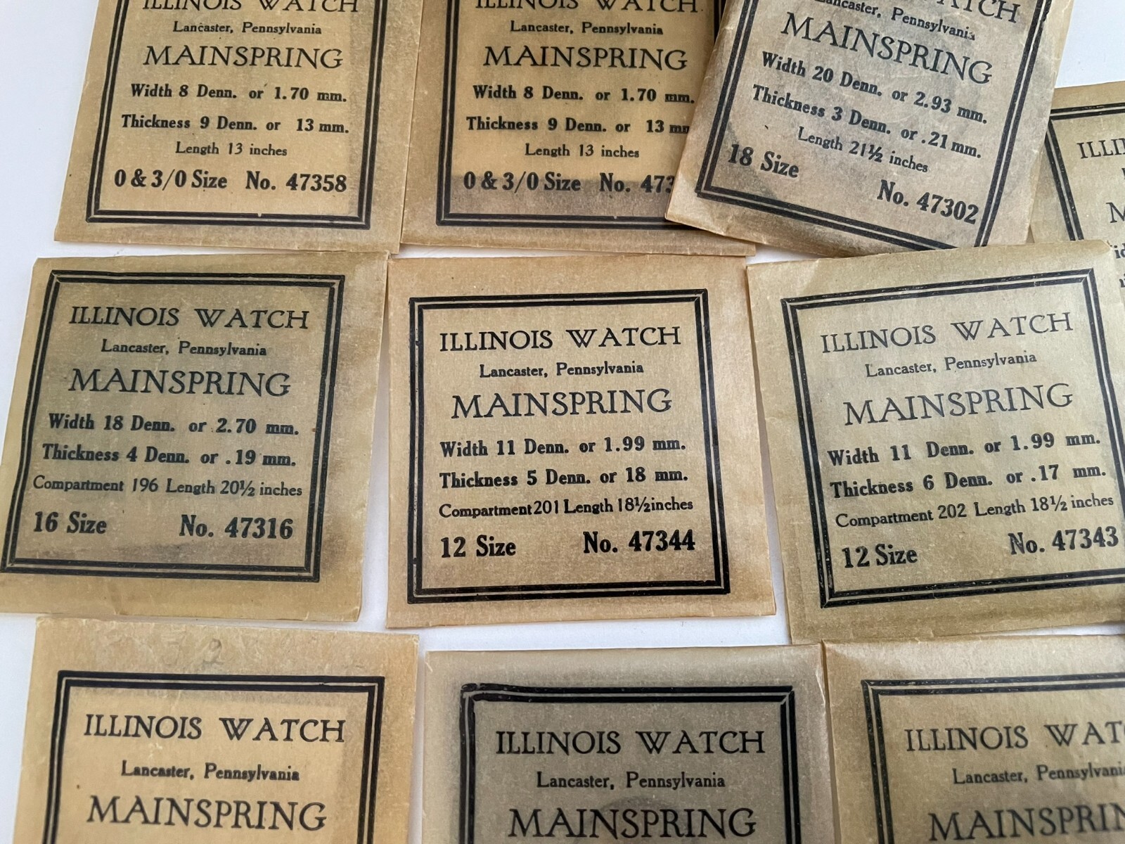 Collection of 11 Illinois Watch Mainsprings of various sizes