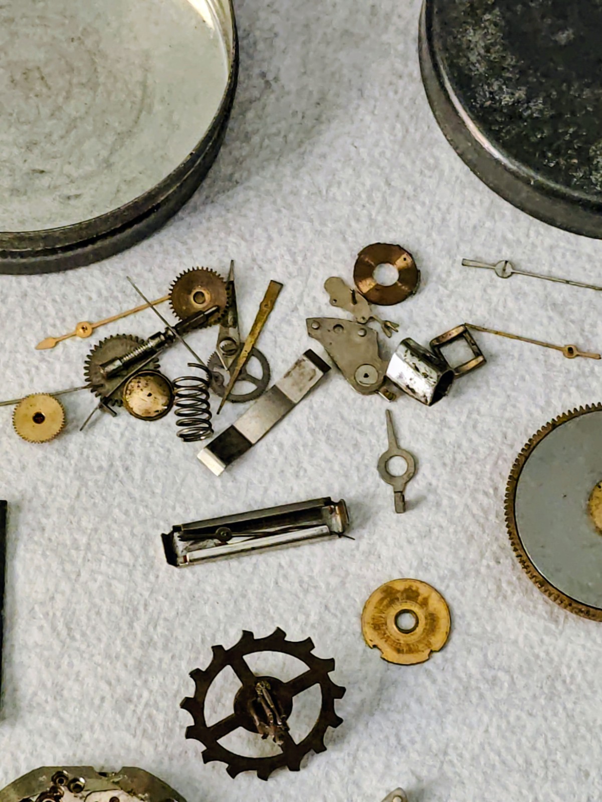 Vintage Watch Parts Including Bulova In A Small Metal Tin Can Approx 13 X 38mm