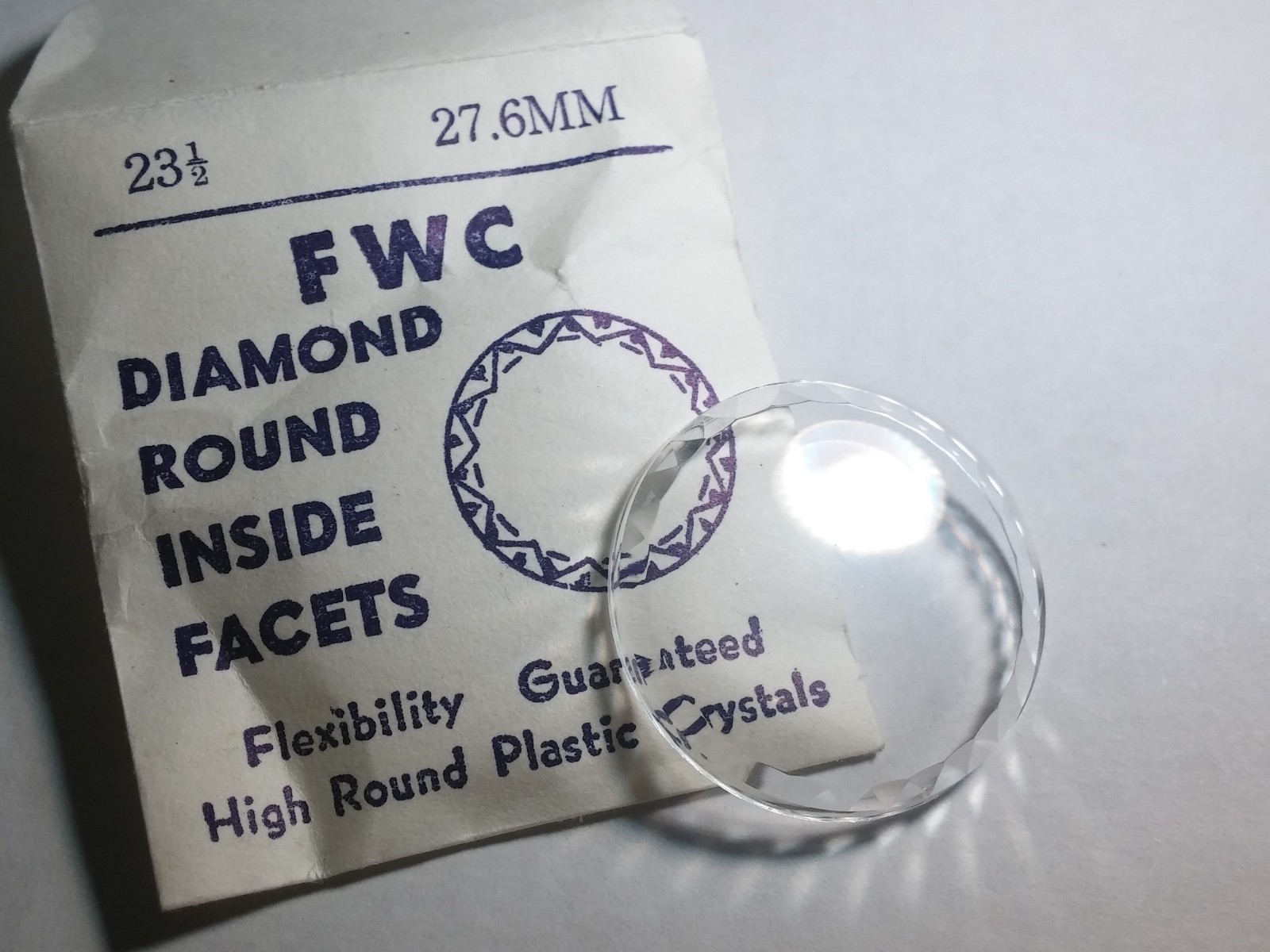 Unbranded crystal diamond round inside facet 27.4mm, 23 1/2, plastic