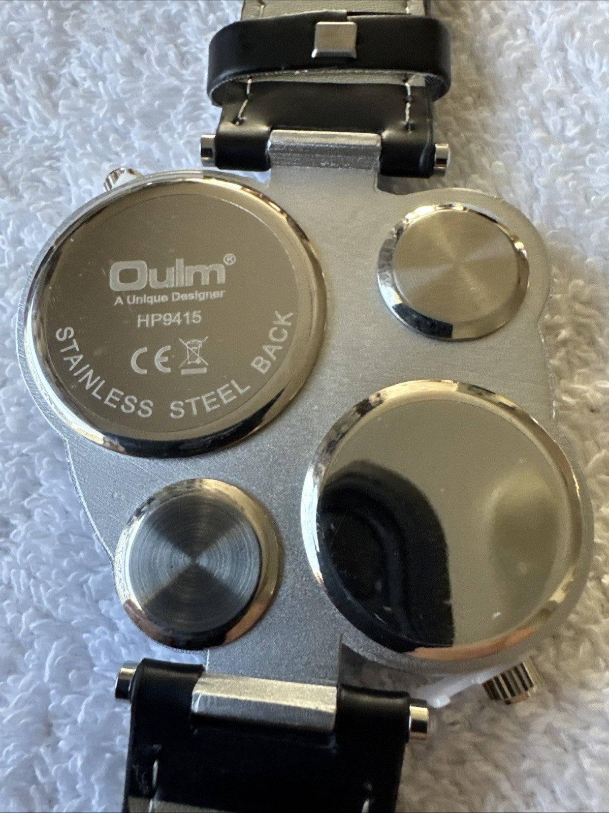 OULM 9415 4 Dial Watch With Two Piece Black Strap Stainless Back