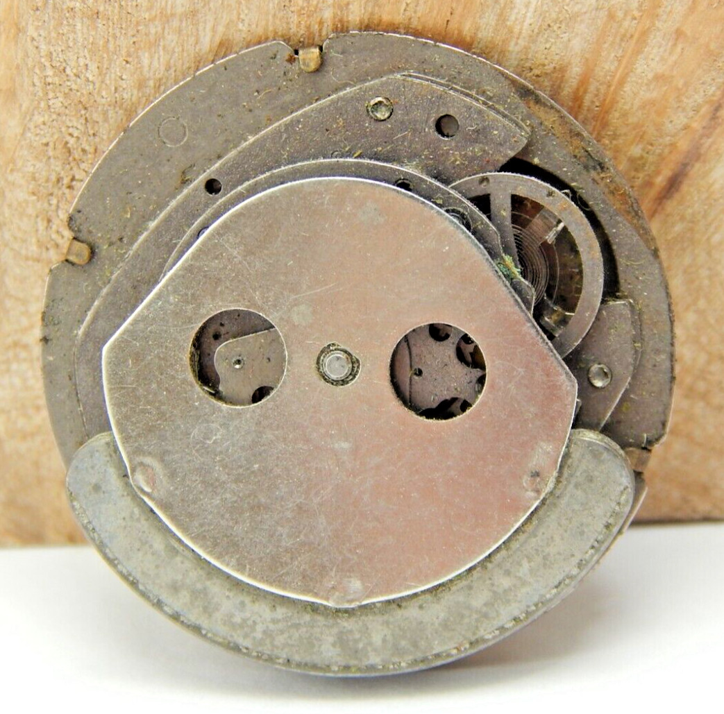 Vintage Timex Automatic men’s wrist watch movement with black dial and hands