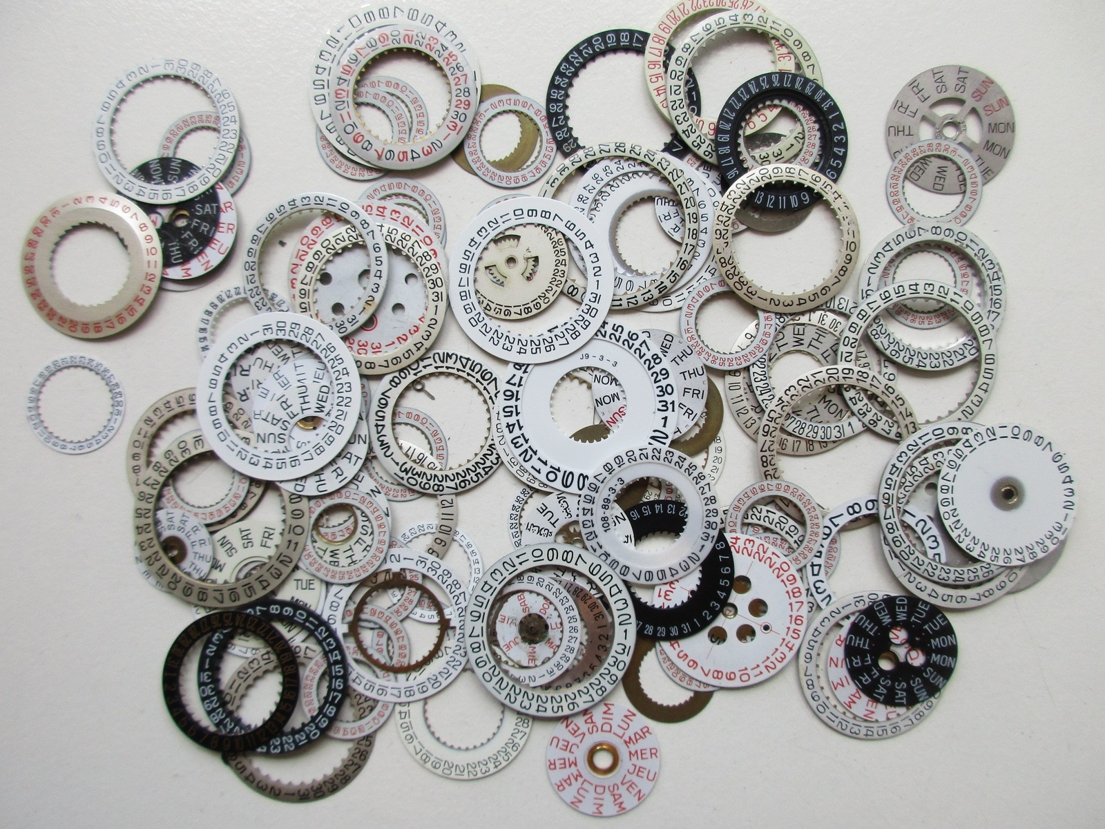 Lot of used Day and Date disks watch movement parts