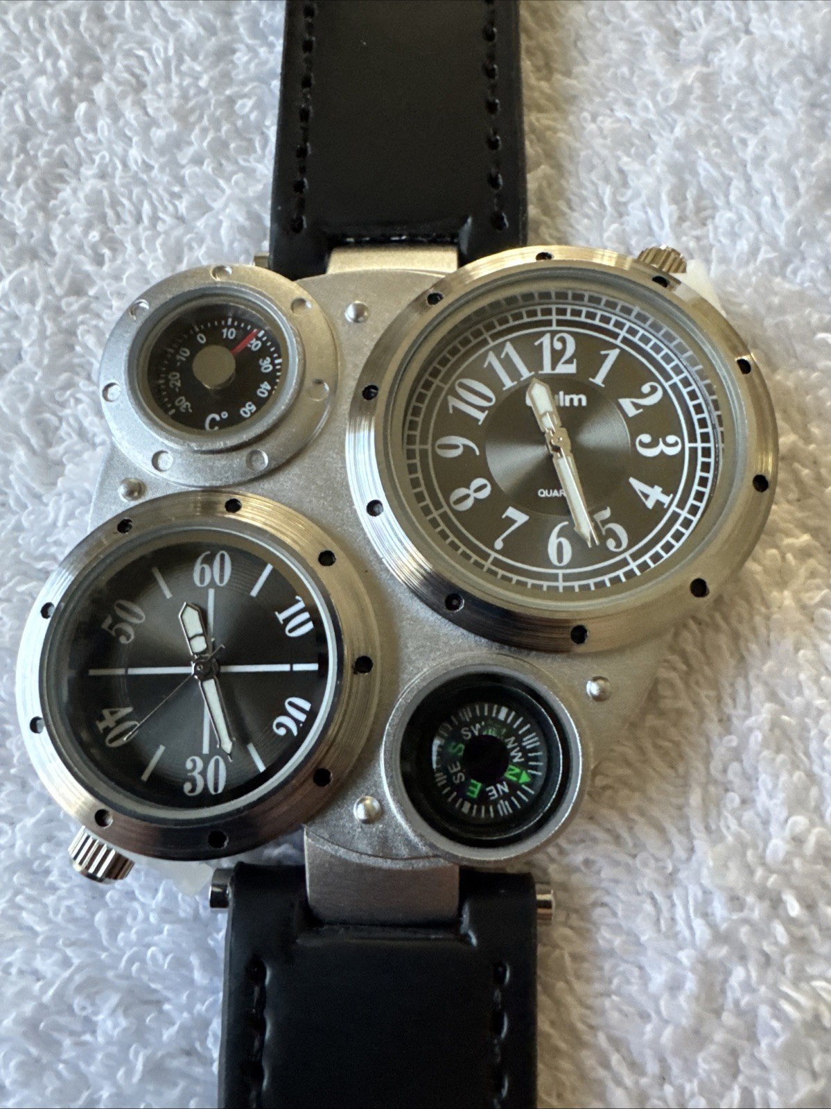 OULM 9415 4 Dial Watch With Two Piece Black Strap Stainless Back