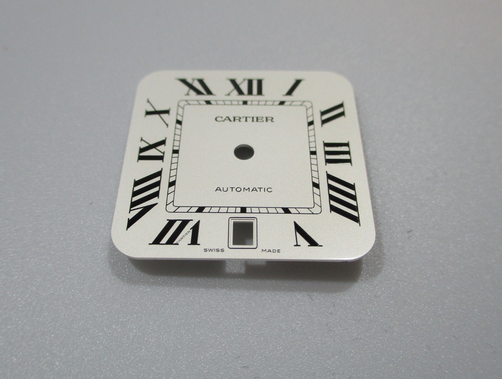 Cartier Santos White Dial Black Roman 40mm Men’s Automatic Steel Ref. WSSA0018?