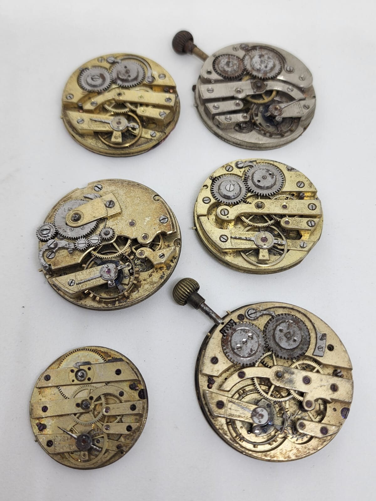 Lot of 6 high end pocket watch movements – Sold for parts – AS IS