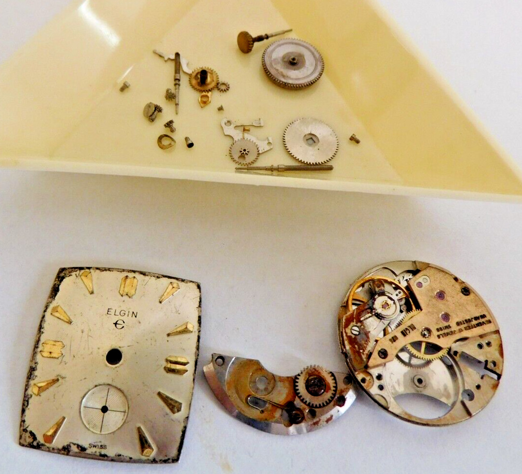 AS 1525 MISC PARTS AND DIAL & HANDS. 17 JEWELS. USED