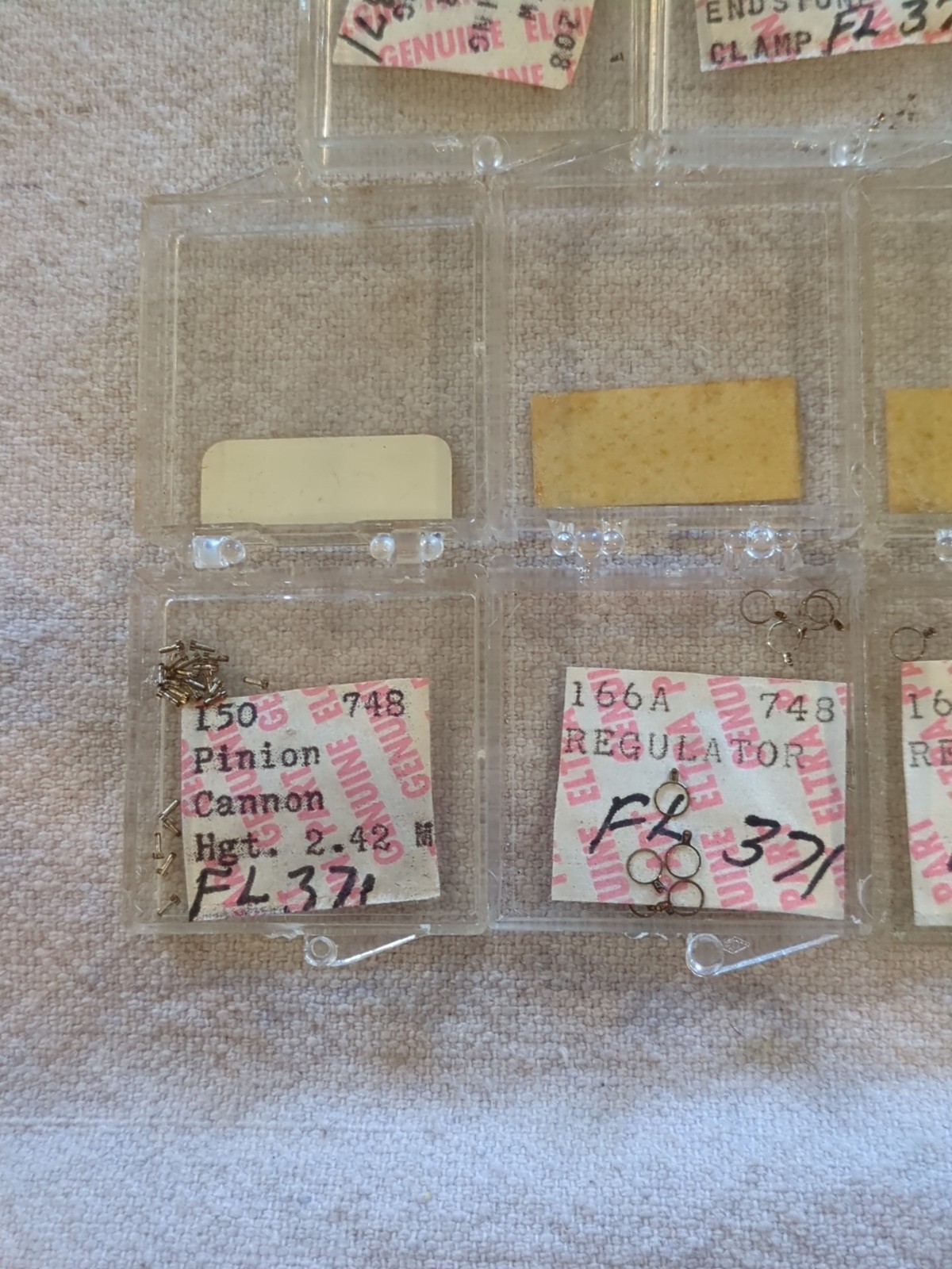 17 Boxes of Elgin 748 Movement Unused Jewels, Screws, Wheels, Regulators Etc…!
