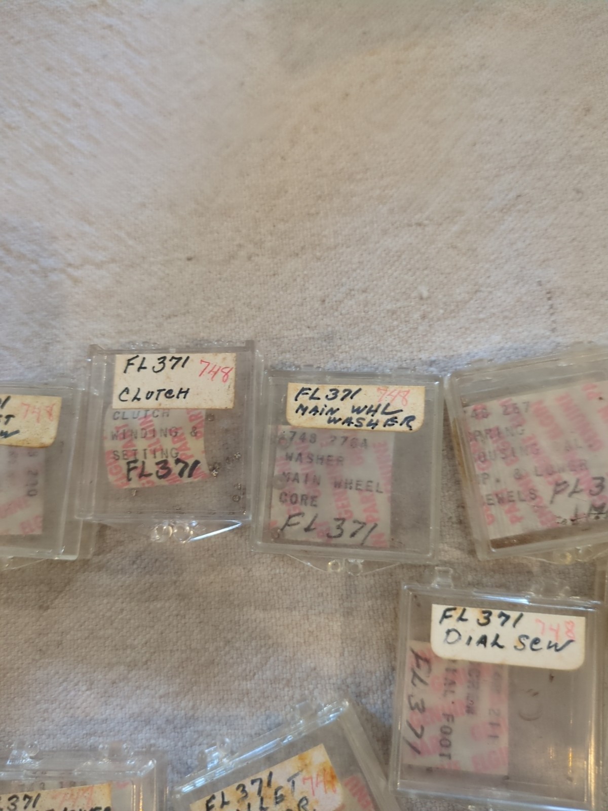 17 Boxes of Elgin 748 Movement Unused Jewels, Screws, Wheels, Regulators Etc…!