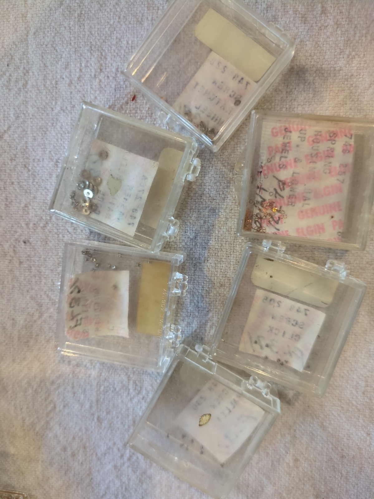 17 Boxes of Elgin 748 Movement Unused Jewels, Screws, Wheels, Regulators Etc…!