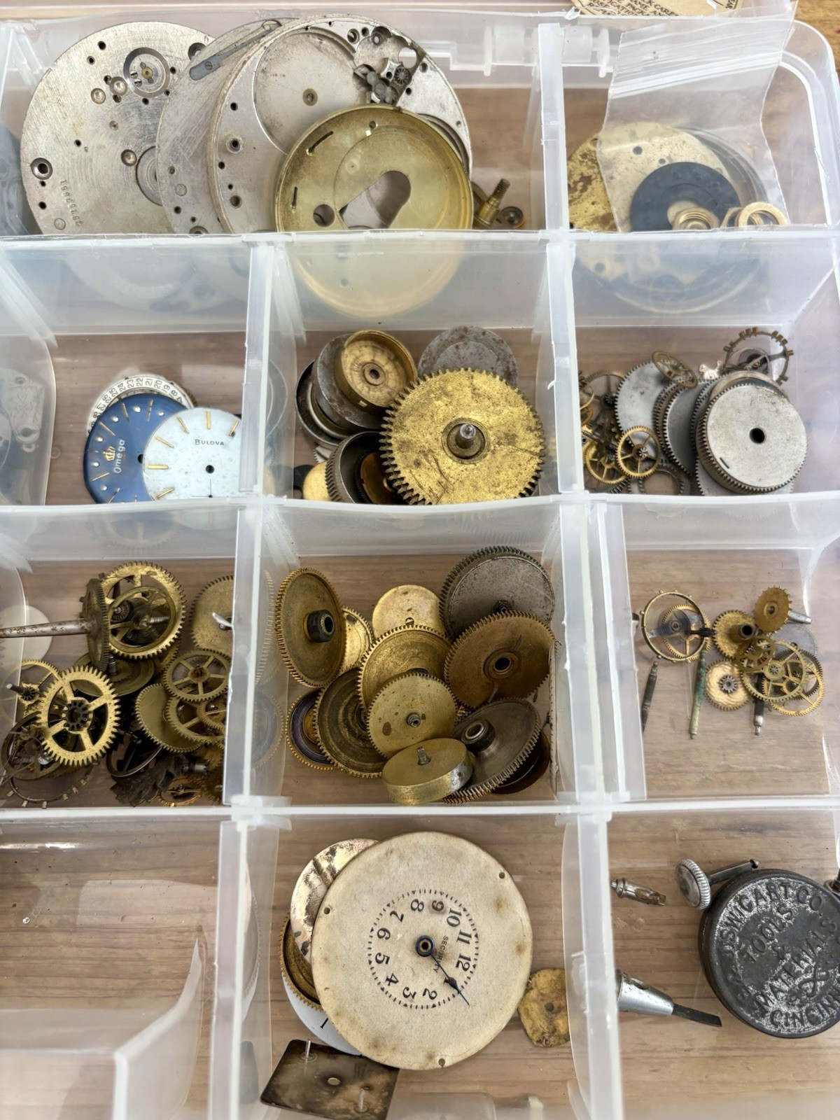Watchmaker parts Lot w/ Box Movements Dials Gears Bulova Omega Benrus Elgin