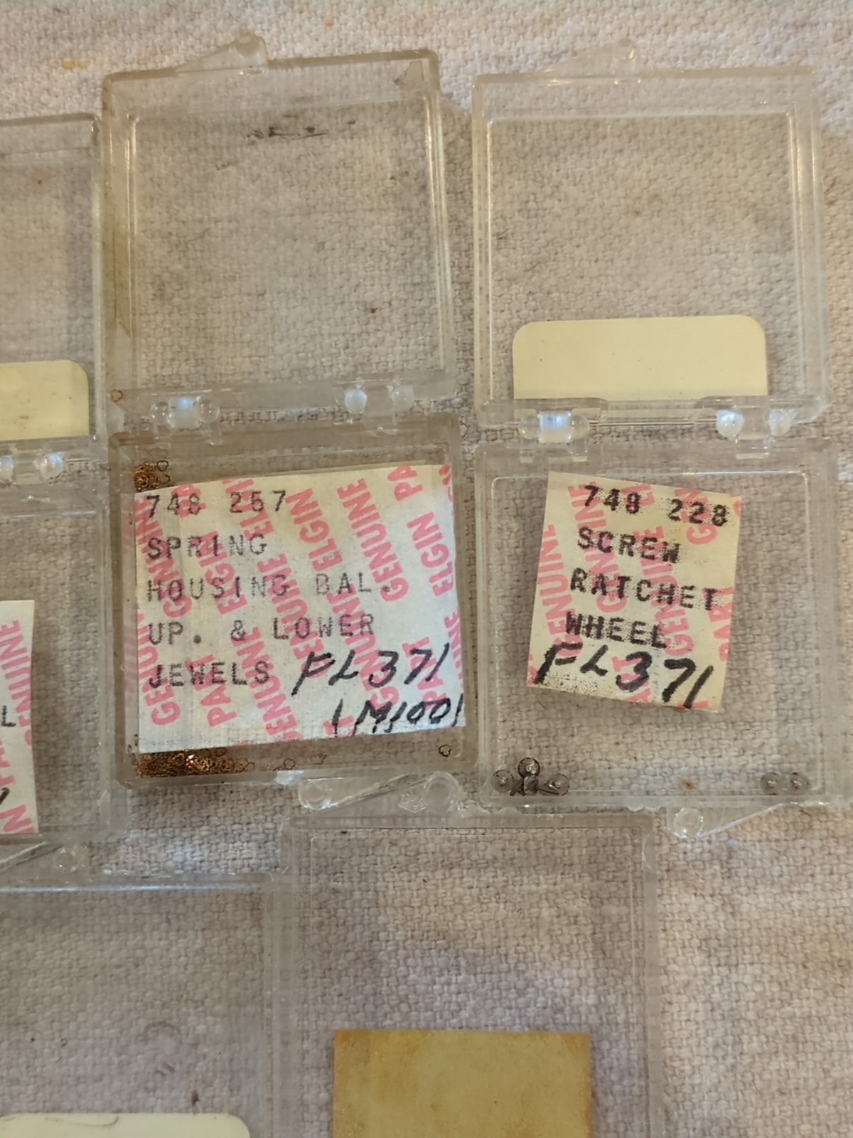 17 Boxes of Elgin 748 Movement Unused Jewels, Screws, Wheels, Regulators Etc…!