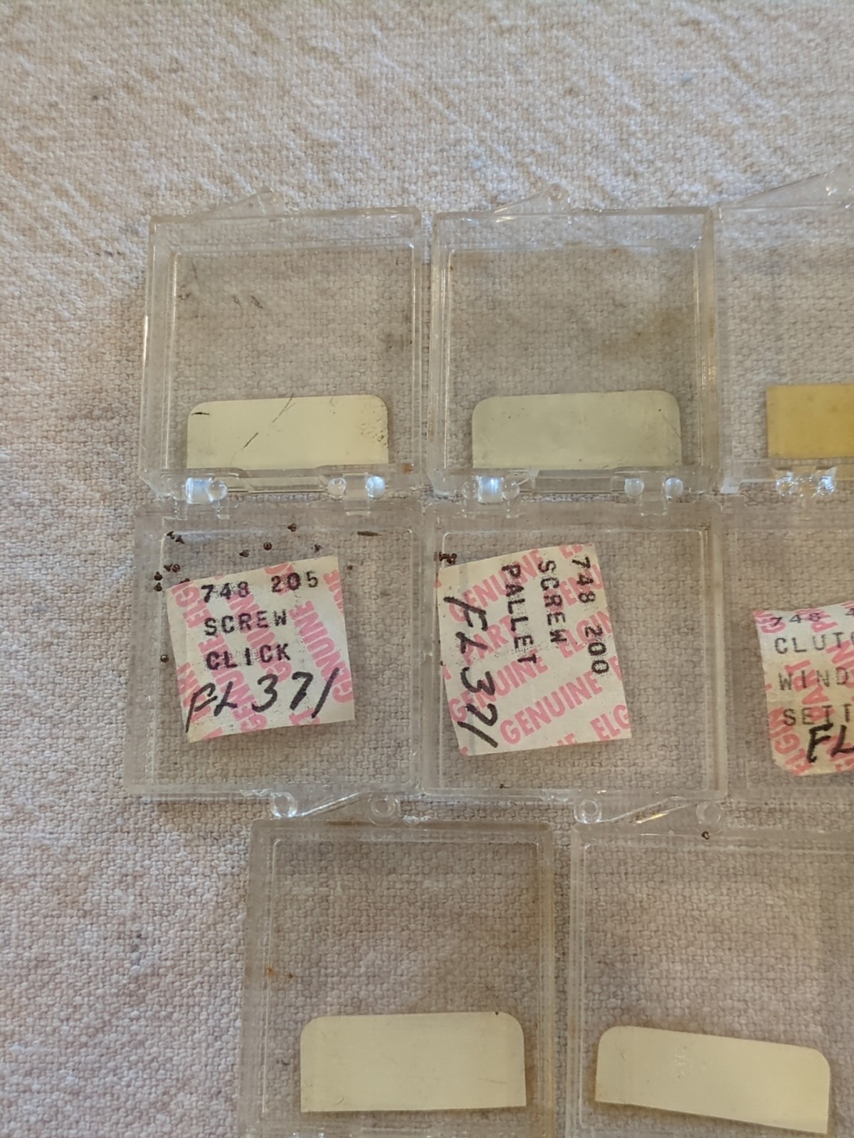 17 Boxes of Elgin 748 Movement Unused Jewels, Screws, Wheels, Regulators Etc…!