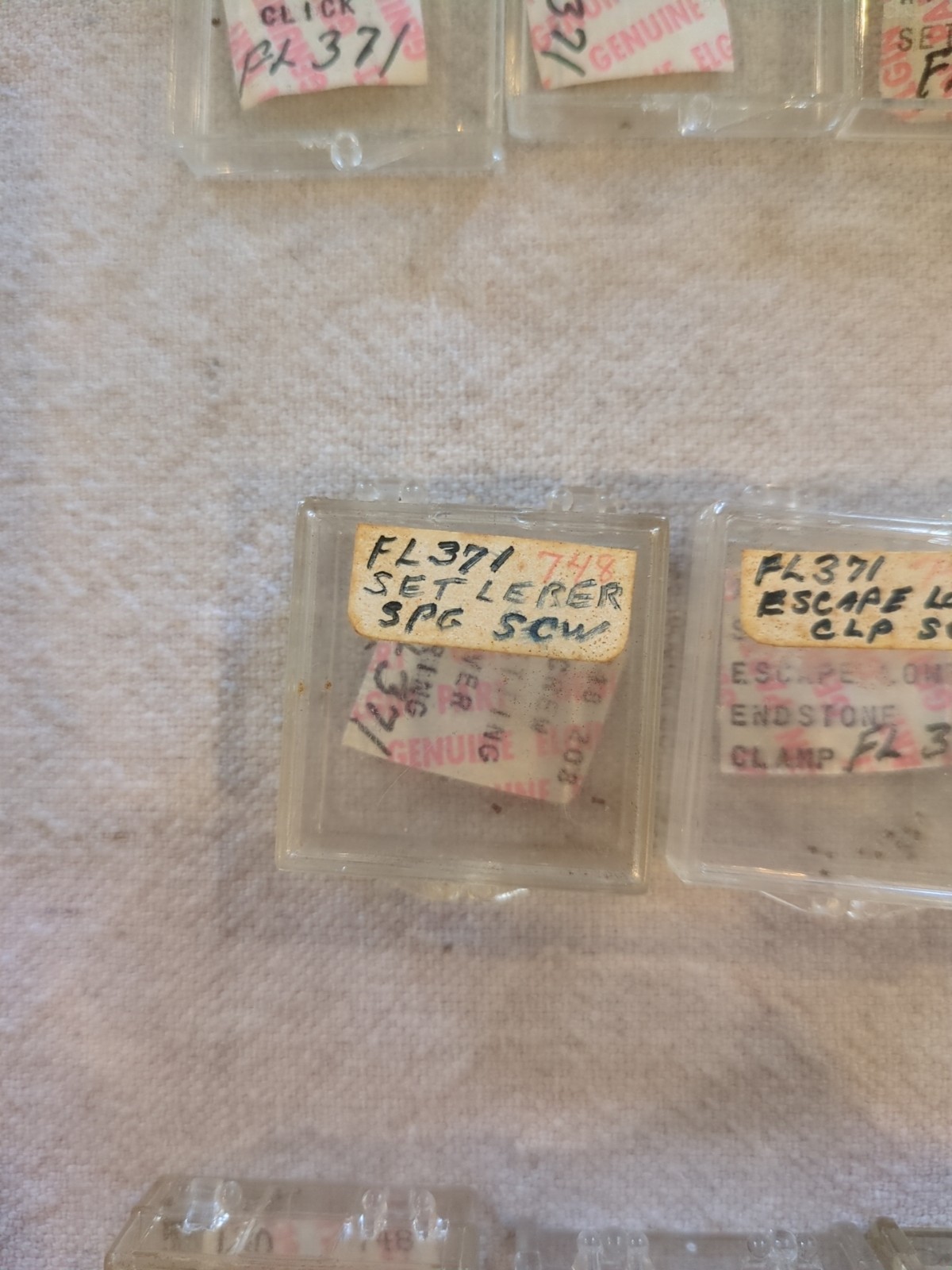 17 Boxes of Elgin 748 Movement Unused Jewels, Screws, Wheels, Regulators Etc…!