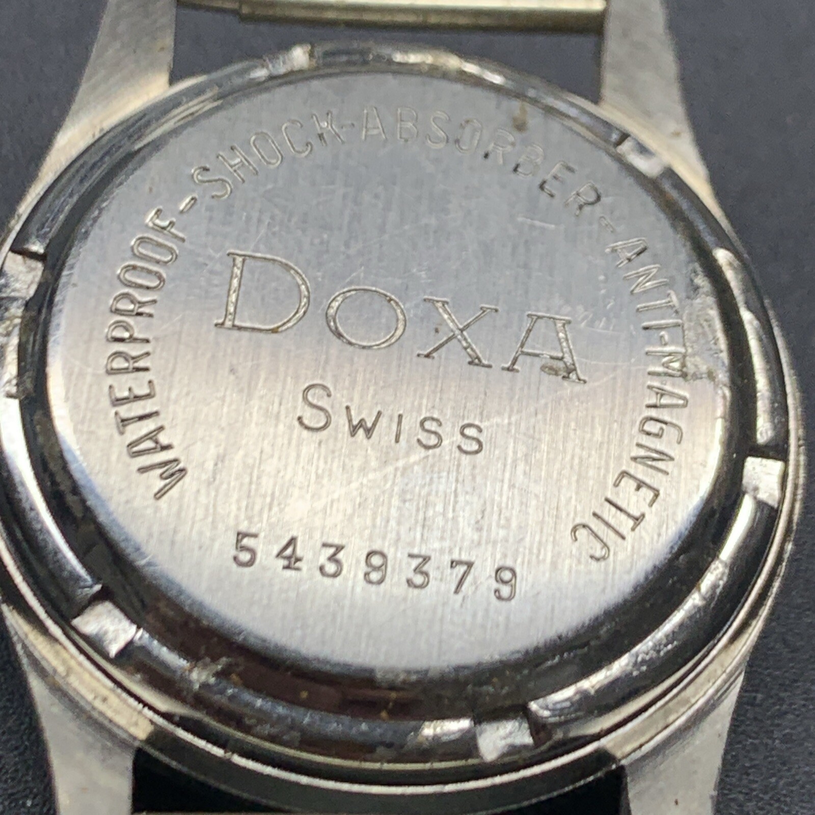 1950s SS NOS Doxa Screw Back Case