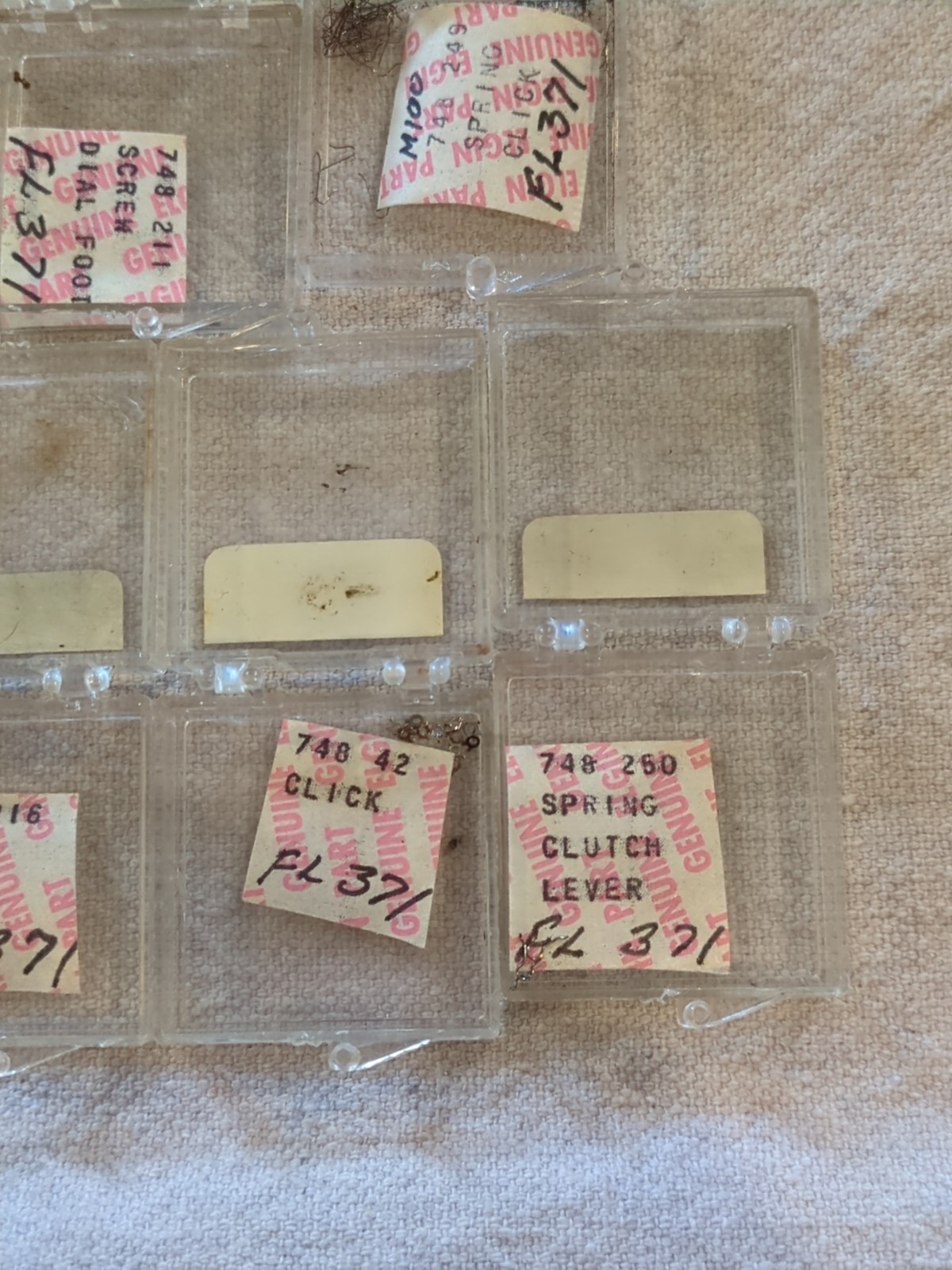 17 Boxes of Elgin 748 Movement Unused Jewels, Screws, Wheels, Regulators Etc…!