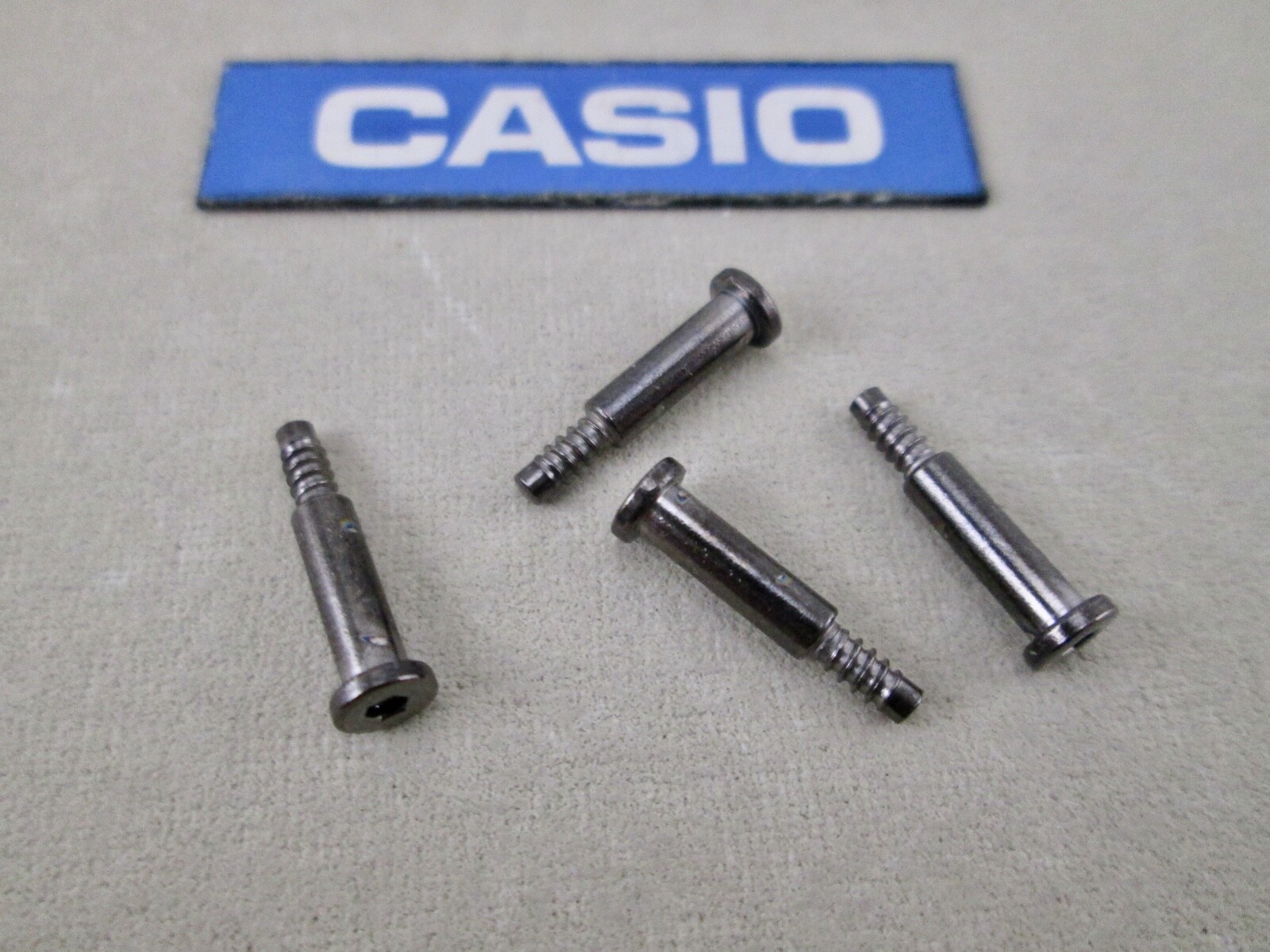 Genuine Casio G-Shock G-1400 GA-1000 GA-1100 GW-4000 watch band screws X 4