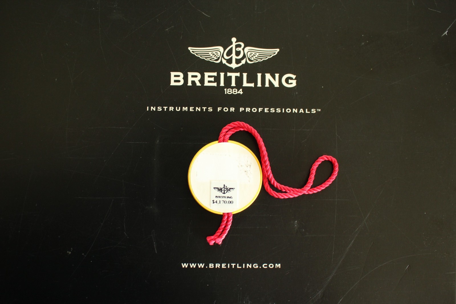 BREITLING FACTORY JEWELERS SALES ACCESSORY YELLOW PLASTIC WATCH HANG – SWING TAG