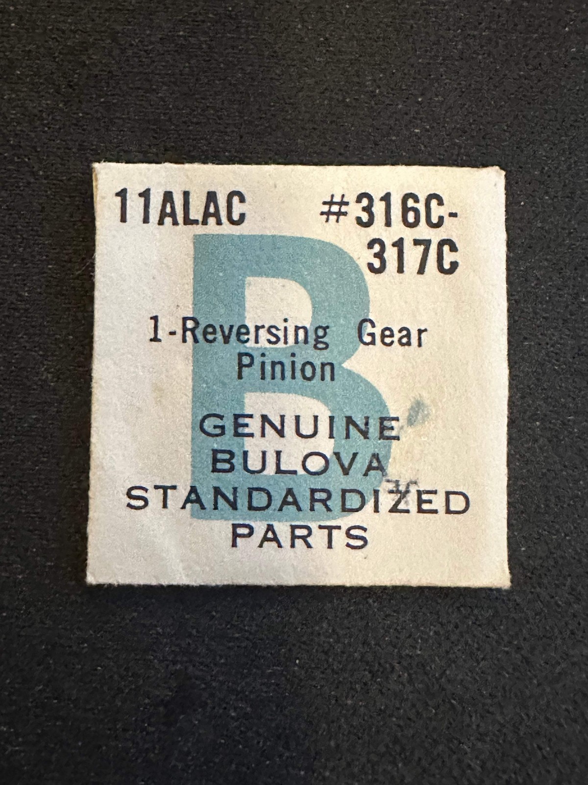 Bulova Factory reversing gear pinion #316C – 317C for caliber 11ALAC – new in en