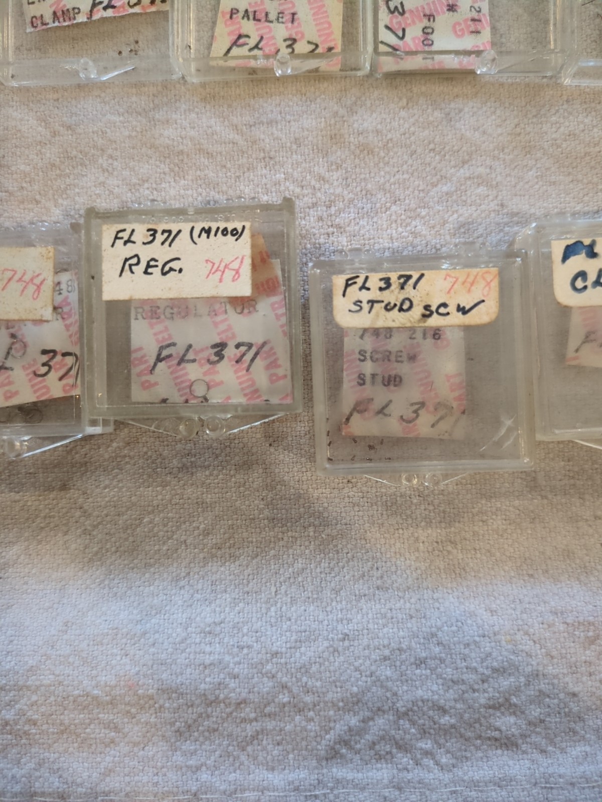 17 Boxes of Elgin 748 Movement Unused Jewels, Screws, Wheels, Regulators Etc…!