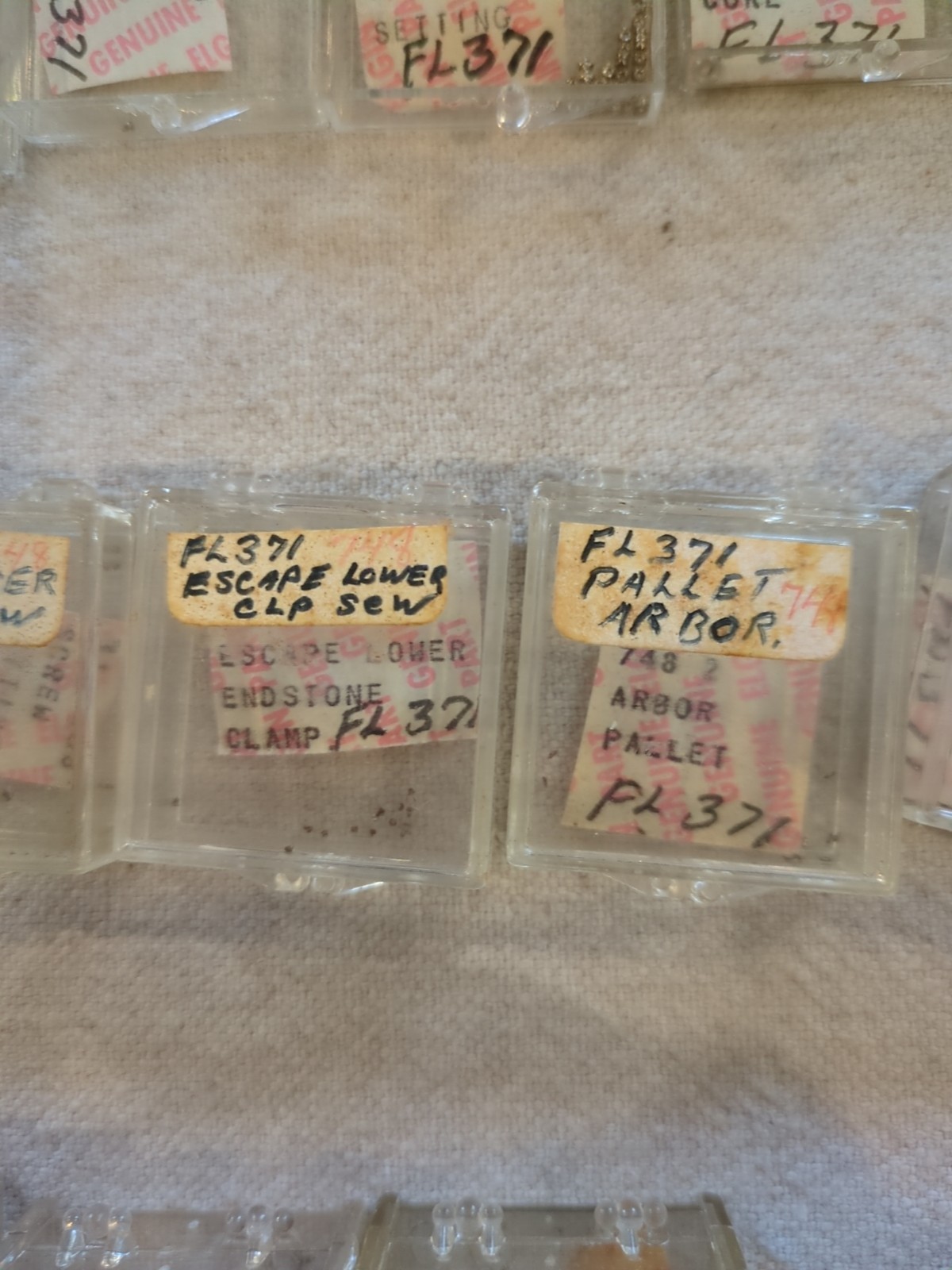 17 Boxes of Elgin 748 Movement Unused Jewels, Screws, Wheels, Regulators Etc…!
