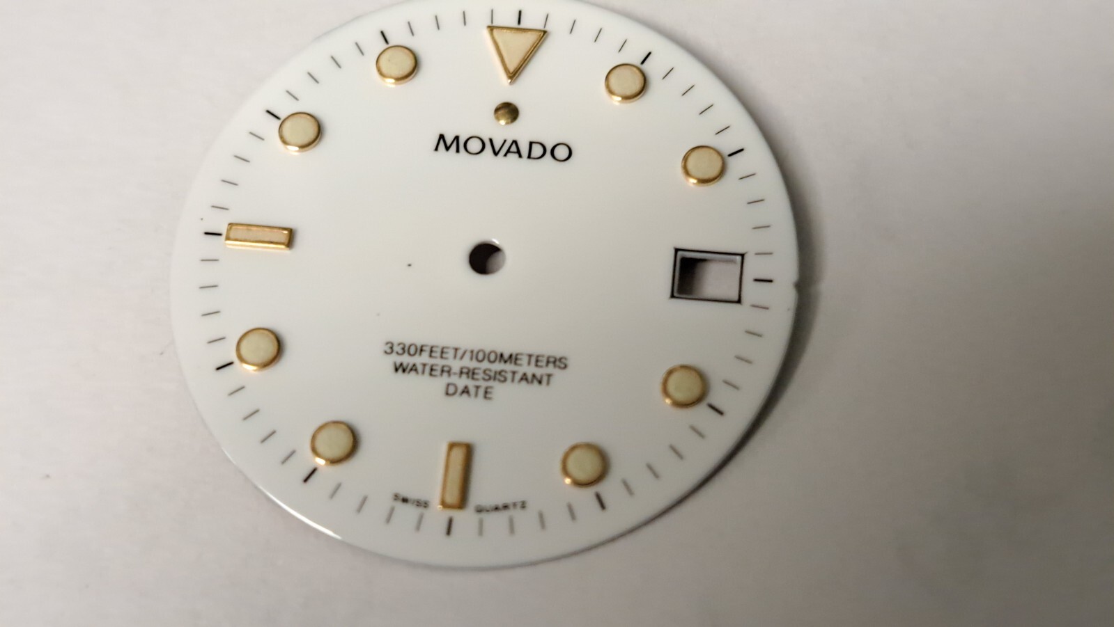 Movado DIAL white with green lume 28.9mm diameter. feet between2 and 3 o’clock a